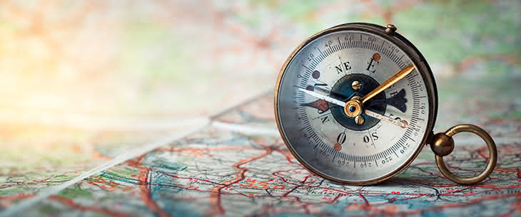 guiding compass on map
